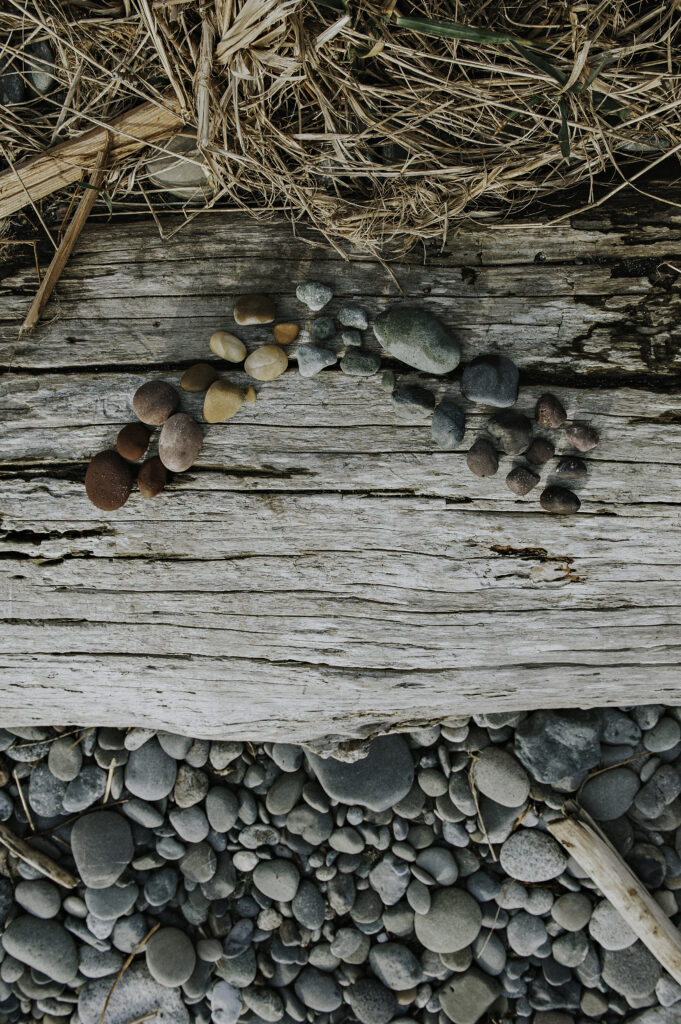 a rainbow made of naturally colored rocks